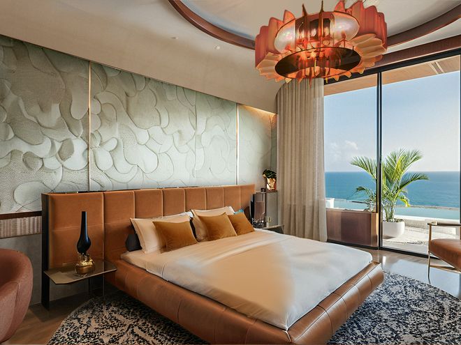 A suite bedroom looking out to the ocean, artist impression